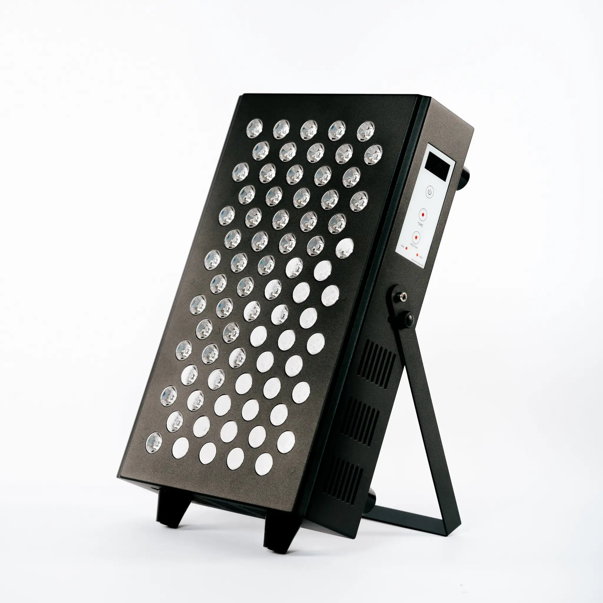 Simple 1EQ red light therapy panel displayed at an angle, showcasing its compact design and tabletop stand.
